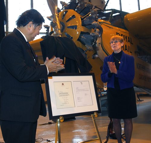 Philip Lee, Lieutenant Governor of Manitoba and Shirley Render, exec. dir. of the Western Canada Aviation Museum unveil correspondence from Rideau Hall and Buckingham Palace in support of the renaming the museum to the Royal Aviation Museum of Western Canada.    Intern has the story. Wayne Glowacki / Winnipeg Free Press Dec.19 2014