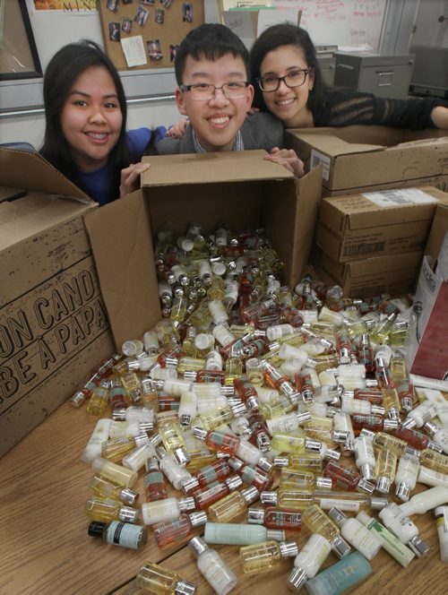 Sisler High school students collected  over 3500 items of person hygiene products for homeless at Siloam Mission- L to R- Gr 11 students Mae Anne Bathan, Calvin Loi, and Ashley Amaral- See Nick Martin Story  Dec 19, 2014   (JOE BRYKSA / WINNIPEG FREE PRESS)