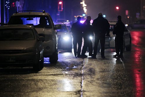 December 21, 2014 - 141221  -  Police investigate a pedestrian mvc on Corydon at Wentworth Sunday, December 21, 2014. John Woods / Winnipeg Free Press