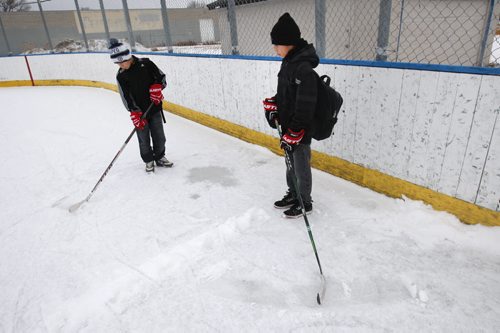 Kids on X-mas break -Jordan Moose and his brother Jason were not to happy when they saw the condition of the outdoor ice at Chalmers Community Club- See Scott Billeck story  Dec 22, 2014   (JOE BRYKSA / WINNIPEG FREE PRESS)