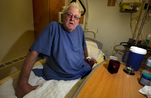 Legless and recovering from a heart attack and pneumonia in Selkirk hospital a feisty Ken Small poses in his hospital bed Monday. See Alex Paul's story re:the intruder / thief that robbed him in his own home. December 22, 2014 - (Phil Hossack / Winnipeg Free Press)