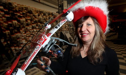 Eliminator RC co-owner  Laurrie Gobeil poses with a  a drone in her Higgins ave toy store Tuesday.  Drones are, ahem, flying off the shelves and under Christmas trees....See Jesse Winter story...... December 23, 2014 - (Phil Hossack / Winnipeg Free Press)