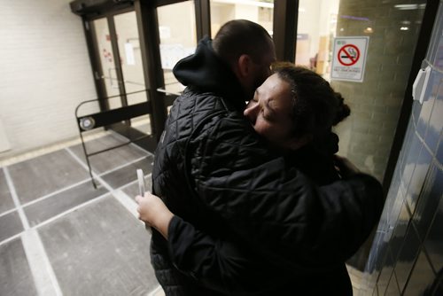 December 23, 2014 - 141223  -  Stephanie Bradley, whose mother Marlene Pelletier was killed and her children injured in a car collision, returned home to find that someone had broken in and stolen christmas gifts and money. Bradley gets a hug from her friend Will Philippot as she talk to media outside HSC Tuesday, December 23, 2014.  John Woods / Winnipeg Free Press