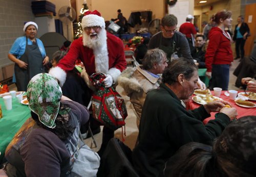 Stdup Local . AGAPE Table is serving 400 turkey dinners with all the trimmings and pumpkin pie Wed. morning , Santa is also visiting and everyone will reciev a Christmas present . Dec. 24 2014 / KEN GIGLIOTTI / WINNIPEG FREE PRESS