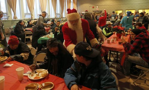 Stdup Local . AGAPE Table is serving 400 turkey dinners with all the trimmings and pumpkin pie Wed. morning , Santa is also visiting and everyone will reciev a Christmas present . Dec. 24 2014 / KEN GIGLIOTTI / WINNIPEG FREE PRESS