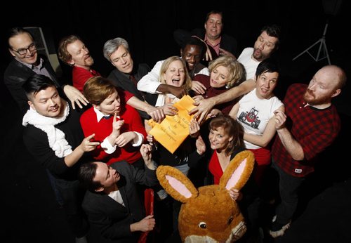 Ent. For a story on the Theatre Projects Manitoba production called White Rabbit, Red Rabbit.  Artistic director Ardith Boxall in the centre holding the scripts with some of the actors taking part in the production. From left to right in front is Tom Keenan and Janice Skene, second row is Loc Lu, Sarah Constible, Sharon Bajer, Shawna Dempsey and Carson Nattress. Back row is Ian Ross, Arne McPherson, Gord Tanner,  Bathelemy Bolivar, Leith Clark and  Stephen Sim pretending to see their scripts. The story is that every night a lone actor will show up on stage and be given the script they have never seen before and then perform it on the spot. Each night a different actor will perform.  Kevin Prokosh story. Wayne Glowacki / Winnipeg Free Press Dec.23 2014