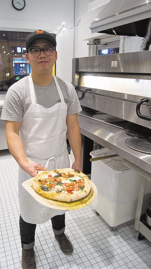 Canstar Community News Dec. 31, 2014 - Terik C, owner of Vera Pizza on Osborne, shows off the F pizza.  (CANSTAR/SOU'WESTER/DANIELLE DA SILVA).