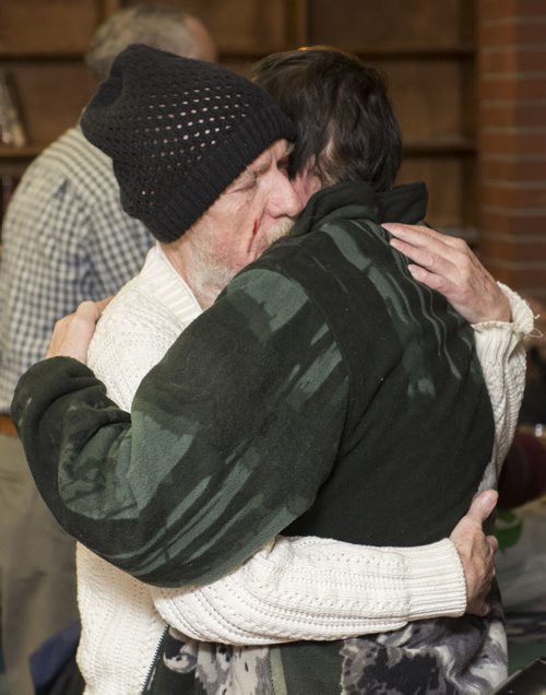 121225 Winnipeg - DAVID LIPNOWSKI / WINNIPEG FREE PRESS  Michael Wilson (left) hugs Claude Roy at the 14th annual Christmas lunch at the West Broadway Community Ministry Thursday afternoon. Claude says that Michael is like a father to him, and this was the first time the two have seen each other in a long time. Every year the Shaarey Zedek synagogue puts on the event.