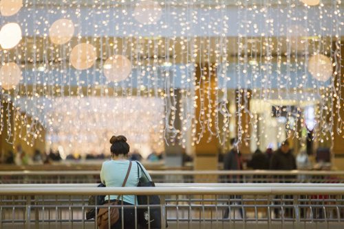 A Boxing Day shopper pauses for a moment amid the chaos at Polo Park Mall in Winnipeg. Dec. 26, 2014. Jesse Winter / WInnipeg Free Press