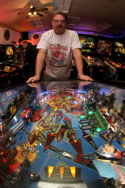 Rick owns close to 50 pinball machines and hosts a group every Friday to play pinball, Friday, December 26, 2014. (TREVOR HAGAN/WINNIPEG FREE PRESS) - for dave sanderson