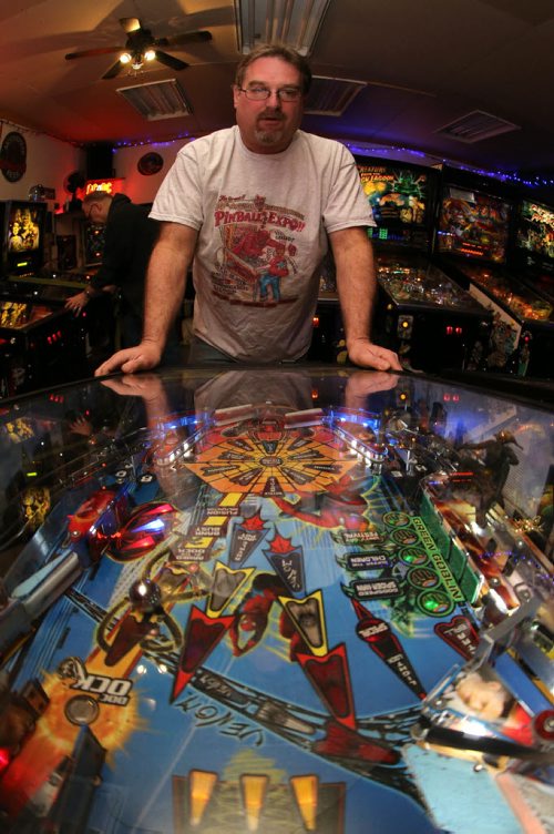 Rick owns close to 50 pinball machines and hosts a group every Friday to play pinball, Friday, December 26, 2014. (TREVOR HAGAN/WINNIPEG FREE PRESS) - for dave sanderson