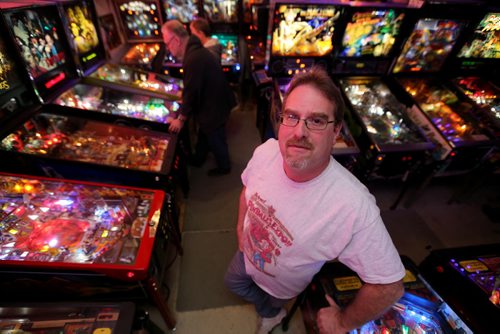 Rick owns close to 50 pinball machines and hosts a group every Friday to play pinball, Friday, December 26, 2014. (TREVOR HAGAN/WINNIPEG FREE PRESS) - for dave sanderson