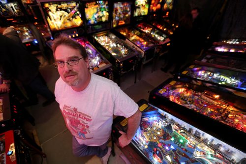 Rick owns close to 50 pinball machines and hosts a group every Friday to play pinball, Friday, December 26, 2014. (TREVOR HAGAN/WINNIPEG FREE PRESS) - for dave sanderson