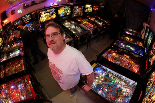 Rick owns close to 50 pinball machines and hosts a group every Friday to play pinball, Friday, December 26, 2014. (TREVOR HAGAN/WINNIPEG FREE PRESS) - for dave sanderson