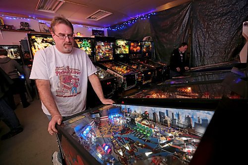 Rick owns close to 50 pinball machines and hosts a group every Friday to play pinball, Friday, December 26, 2014. (TREVOR HAGAN/WINNIPEG FREE PRESS) - for dave sanderson