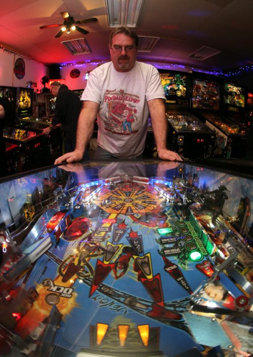 Rick owns close to 50 pinball machines and hosts a group every Friday to play pinball, Friday, December 26, 2014. (TREVOR HAGAN/WINNIPEG FREE PRESS) - for dave sanderson