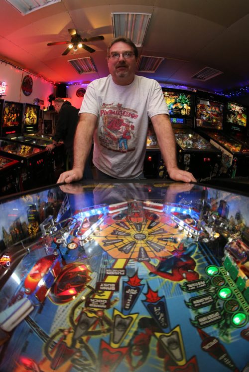 Rick owns close to 50 pinball machines and hosts a group every Friday to play pinball, Friday, December 26, 2014. (TREVOR HAGAN/WINNIPEG FREE PRESS) - for dave sanderson