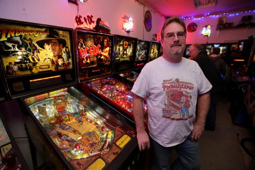 Rick owns close to 50 pinball machines and hosts a group every Friday to play pinball, Friday, December 26, 2014. (TREVOR HAGAN/WINNIPEG FREE PRESS) - for dave sanderson