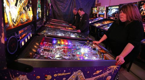 Enthusiasts playing. Rick owns close to 50 pinball machines and hosts a group every Friday to play pinball, Friday, December 26, 2014. (TREVOR HAGAN/WINNIPEG FREE PRESS) - for dave sanderson
