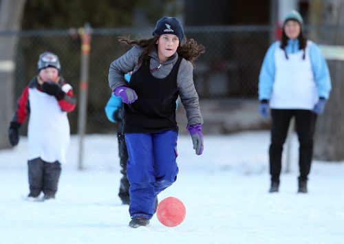 Jasmine Decaire, 10, runs with the ball during soccer action at the 16th annual ÄòSnow BowlÄô at La Verendrye School in Crescentwood on Dec. 27, 2014. Photo by Jason Halstead/Winnipeg Free Press