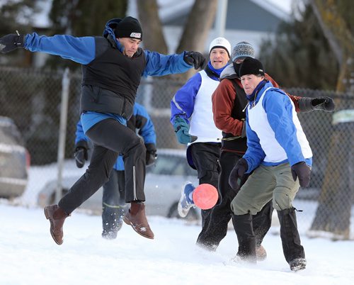 Salim Loxley (left) controls the ball during soccer action at the 16th annual ÄòSnow BowlÄô at La Verendrye School in Crescentwood on Dec. 27, 2014. Photo by Jason Halstead/Winnipeg Free Press