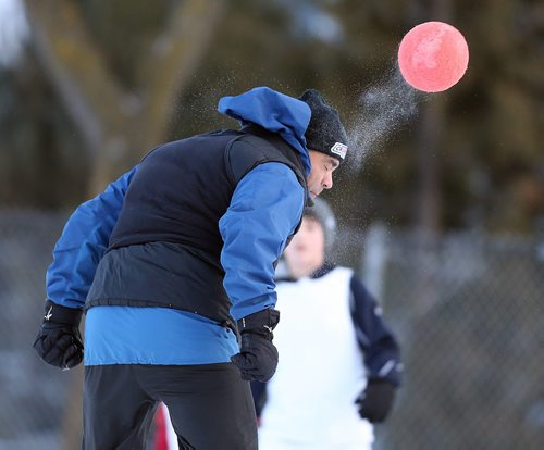 Salim Loxley heads the ball during soccer action at the 16th annual ÄòSnow BowlÄô at La Verendrye School in Crescentwood on Dec. 27, 2014. Photo by Jason Halstead/Winnipeg Free Press