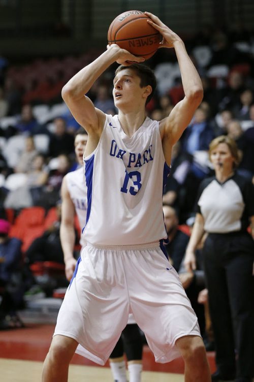 December 28, 2014 - 141228  - Oak Park Raiders William Kohler (13) goes up for the 2 points against John Taylor Pipers in the high school semi-final game in the Wesmen Classic at the University of Winnipeg Sunday, December 28, 2014.  John Woods / Winnipeg Free Press