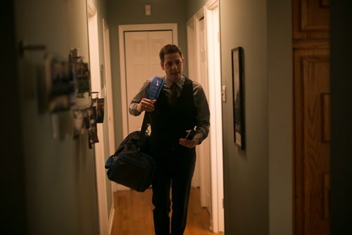 6:39:31 AM Brian showered and dressed quickly in his three-piece suit after his morning workout, and placed belongings into a gym bag for the day. 141215 - Monday, December 15, 2014 - (Melissa Tait / Winnipeg Free Press)