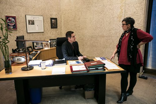 8:31:58 AM - office First thing after arriving in the office, communications director Carmen Barnett touches base with Bowman before the 8:45 a.m. staff meeting. 141215 - Monday, December 15, 2014 - (Melissa Tait / Winnipeg Free Press)