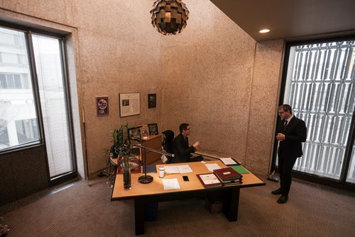 10:40:02 AM Bowman talks at his desk with chief of staff Jason Fuith  141215 - Monday, December 15, 2014 - (Melissa Tait / Winnipeg Free Press)