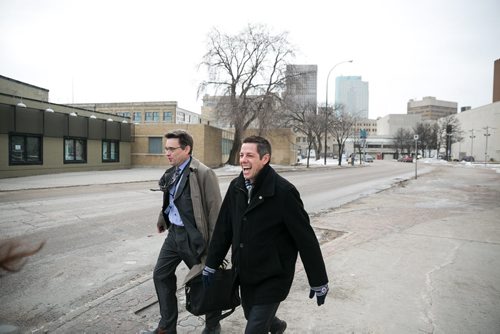 11:23:52 AM Bowman laughs with St. Vital councillor Brian Mayes when they meet up on Lily St on their way to the Sport for Life Centre.  141215 - Monday, December 15, 2014 - (Melissa Tait / Winnipeg Free Press)