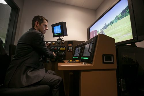 2:03:42 PM  The first stop on the tour of Transcona was the new CN Campus, which opened in September 2014 to train CN employees from across Canada. Bowman got a chance to take a seat in an engine simulator. 141215 - Monday, December 15, 2014 - (Melissa Tait / Winnipeg Free Press)