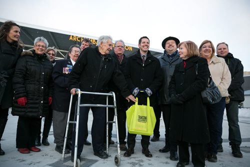 2:58:06 PM Another group photo on third tour to view the new Transcona Centennial Square.  141215 - Monday, December 15, 2014 - (Melissa Tait / Winnipeg Free Press)