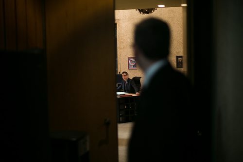 5:06:51 PM Chief of staff Jason Fuith prepares to leave for the day, and a final chat through the office doorway with Mayor Bowman.  141215 - Monday, December 15, 2014 - (Melissa Tait / Winnipeg Free Press)