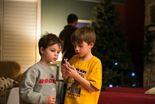 7:43:51 PM  The Bowman sons check out decorations from the classic movie A Christmas Story, including Ralphie dressed in a bunny costume. 141215 - Monday, December 15, 2014 - (Melissa Tait / Winnipeg Free Press) Brian Bowman