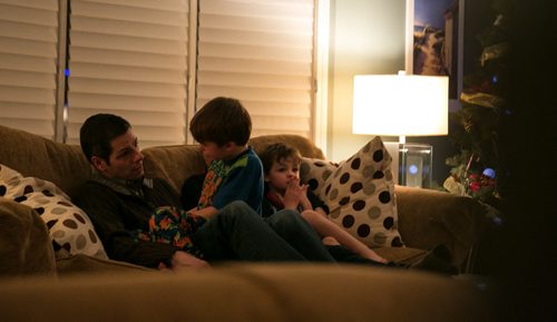 8:19:19 PM  Hayden is calmed by Brian after getting upset he lost a race with Austin back to the sofa to read a story. 141215 - Monday, December 15, 2014 - (Melissa Tait / Winnipeg Free Press) Brian Bowman