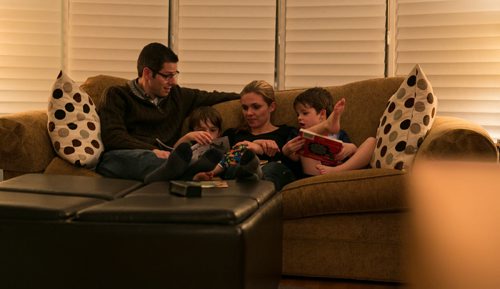 8:23:47 PM The family regularly reads stories on the couch in the living room, rather than in the boys' bedrooms.  141215 - Monday, December 15, 2014 - (Melissa Tait / Winnipeg Free Press) Brian Bowman