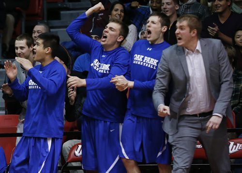 December 30, 2014 - 141230  - Oak Park Raiders react as they score a three on the Garden City Fighting Gophers in the high school final game in the Wesmen Classic at the University of Winnipeg Tuesday, December 30, 2014.  John Woods / Winnipeg Free Press   John Woods / Winnipeg Free Press