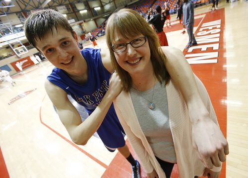 December 30, 2014 - 141230  - Oak Park Raiders William Kohler (13) poses for a photograph with his mother Lynne after the high school final game in the Wesmen Classic at the University of Winnipeg Tuesday, December 30, 2014.  John Woods / Winnipeg Free Press