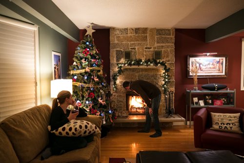 8:36:14 PM -  After the kids are in bed, and before Brian checks in on email around 9pm, Tracy and Brian Bowman sit together in the family room.  141215 - Monday, December 15, 2014 - (Melissa Tait / Winnipeg Free Press) Brian Bowman