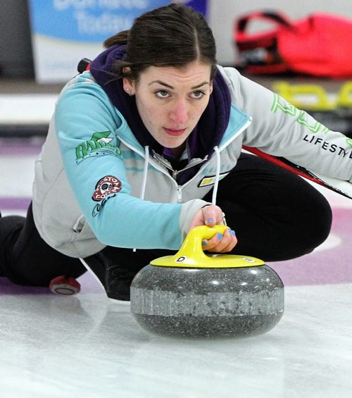 Skip Beth Peterson throws a rock in the final end just before winning the Junior Women's Provincial Championship at the Assiniboine Memorial Curling Club Wednesday evening.  141231 December 31, 2014 Mike Deal / Winnipeg Free Press