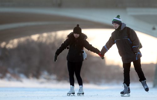 Desirae Lavallee and Jayden Bannerman enjoy skating together along the Red River on the newly opened River Trail Thursday.  Jan 01, 2015 Ruth Bonneville / Winnipeg Free Press