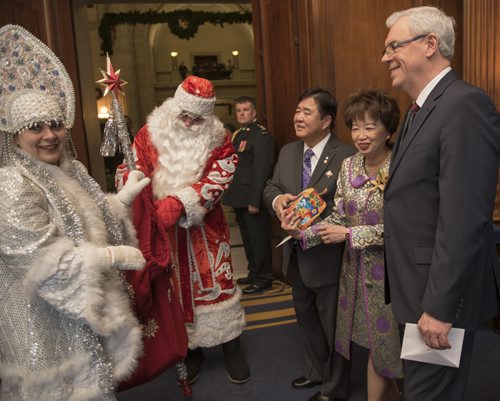 150101 Winnipeg - DAVID LIPNOWSKI / WINNIPEG FREE PRESS  Igor and Sophie Leshkov are dressed as Ded Moroz (Father Frozen) and grand daughter Snegurochka (characters from a Russian New Years story) Thursday January 1, 2015 as they greet Manitoba Lt.-Gov. Philip Lee, his wife Anita, and Premier Greg Selinger at the annual public New Year's Levee at the Manitoba Legislative Building.