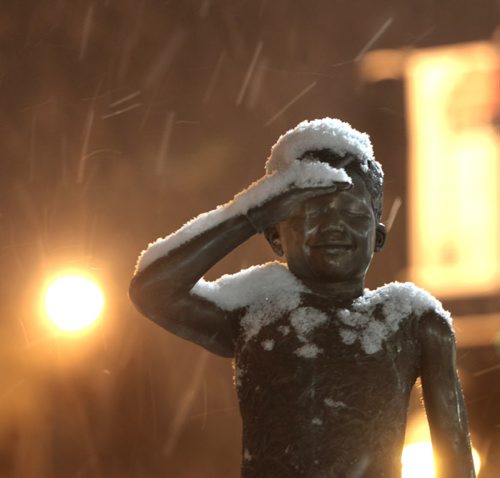 Snow falls Friday morning on a  sculpture of a child in the sculpture garden at La Maison Des Artistes in St. Boniface . For weather  story.  Wayne Glowacki / Winnipeg Free Press Jan. 2 2015