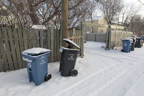 The bin at left where the child was placed in  behind a house in the 500 block of Pritchard Ave. New Year's Day. intern  story.  Wayne Glowacki / Winnipeg Free Press Jan. 2 2015