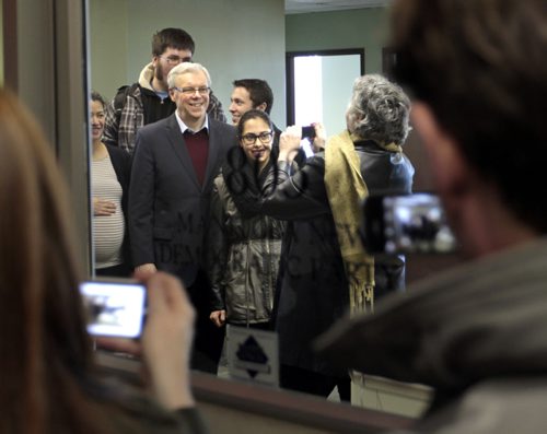 Premier Greg Selinger poses for a picture with  supporters in the  NDP office Friday after becoming a candidate in the March NDP leadership race.  Larry Kusch story.  Wayne Glowacki / Winnipeg Free Press Jan. 2 2015