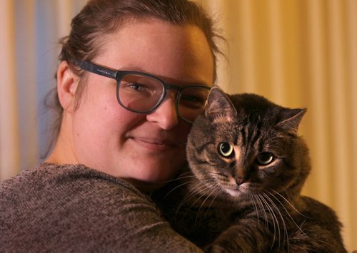 Jackie Miller with her  indoor cat Leo. She is unsure why there is a new licensing fee for indoor cats with a tattoo.   See Brittany Hobson (intern) story  Jan 02, 2015 Ruth Bonneville / Winnipeg Free Press