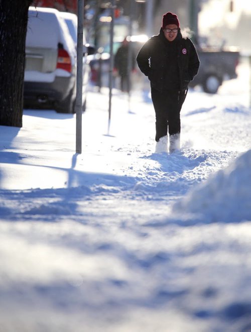 A pedestrian walks near the corner of Corydon Avenue and Stafford Street, Saturday, January 3, 2015. (TREVOR HAGAN/WINNIPEG FREE PRESS)