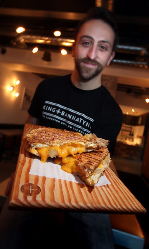 King + Bannaytne's Mike Del Buono shows off this week's grilled cheese, the "Apple Pie" at the eatery located at the intersection of it's name. This is for an Intersection piece on gourmet grilled cheese sandwiches. I went around town looking for some of the best/most unique & heres what I came up with. (Well need vertical pics of at least one locale  not sure how many pics we want to run along  with story) January 5, 2015 - (Phil Hossack / Winnipeg Free Press)