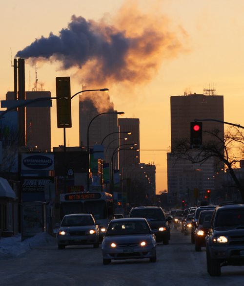 Golden light as the sun rises as seen on NotreDame Ave Tuesday morning-standup photo  Jan 06, 2015   (JOE BRYKSA / WINNIPEG FREE PRESS)